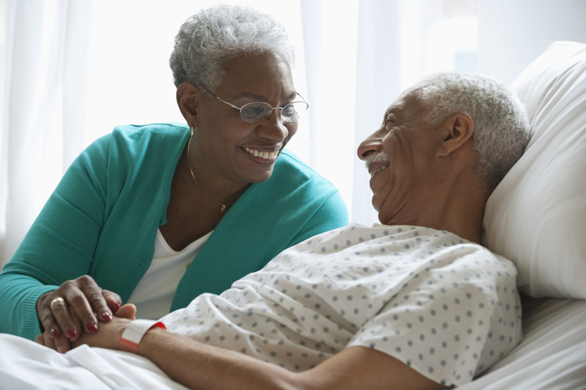Elderly women keeping hospitalized husband company